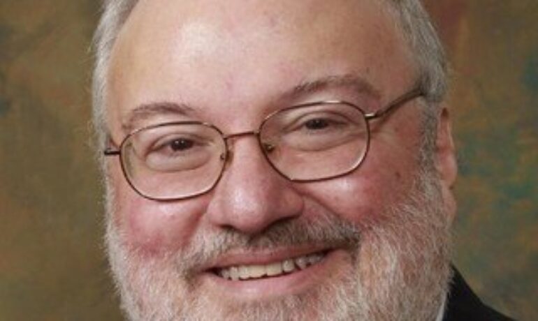 J. Raymond Karam