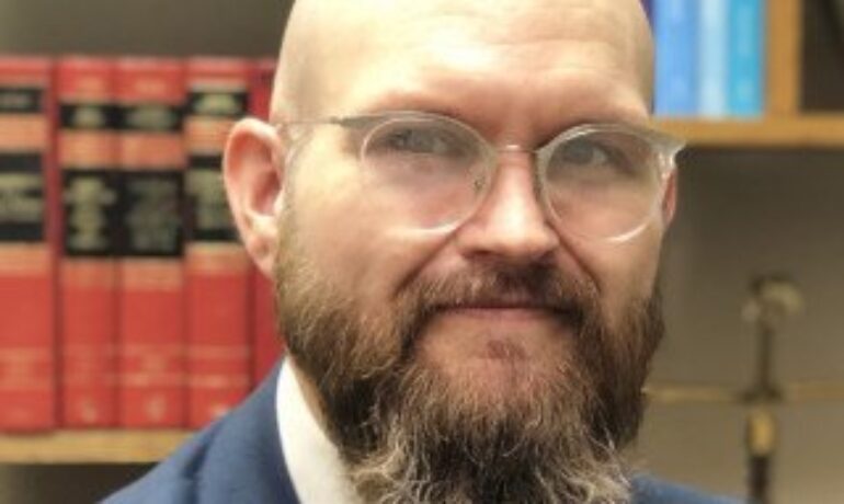 Justin P. Enecks