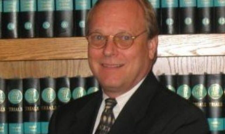 James E. Riha